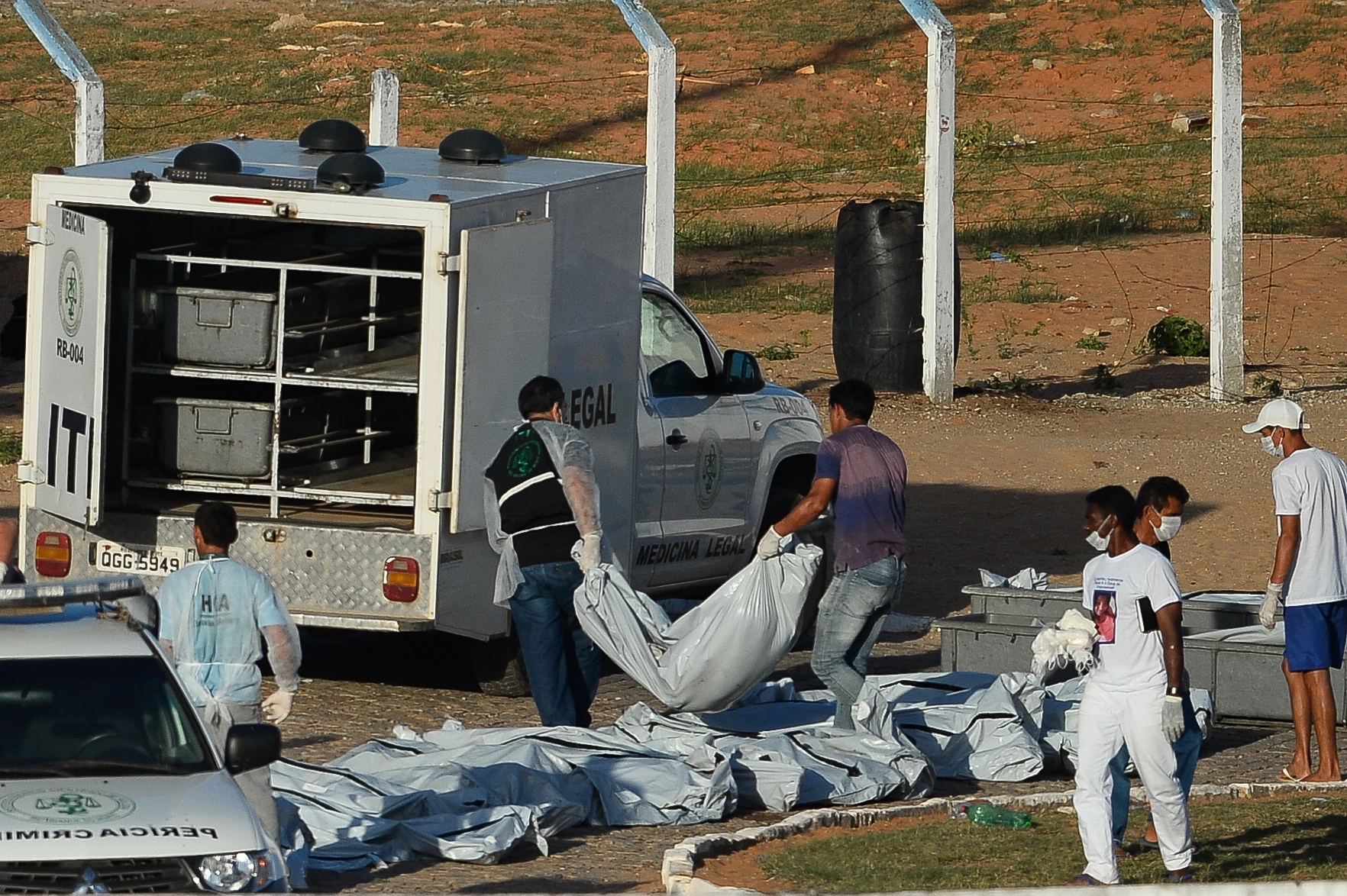 Corpses are being removed from the Alcacuz Penitentiary after a fight between rival gangs left at least 30 prisoners dead on the eve, near Natal, in the Brazilian northeastern state of Rio Grande do Norte, on January 15, 2017.The latest in a string of brutal prison massacres involving suspected gang members in Brazil is thought to have killed more than 30 people, including some who were beheaded, officials said Sunday. / AFP / ANDRESSA ANHOLETE (Photo credit should read ANDRESSA ANHOLETE/AFP/Getty Images)