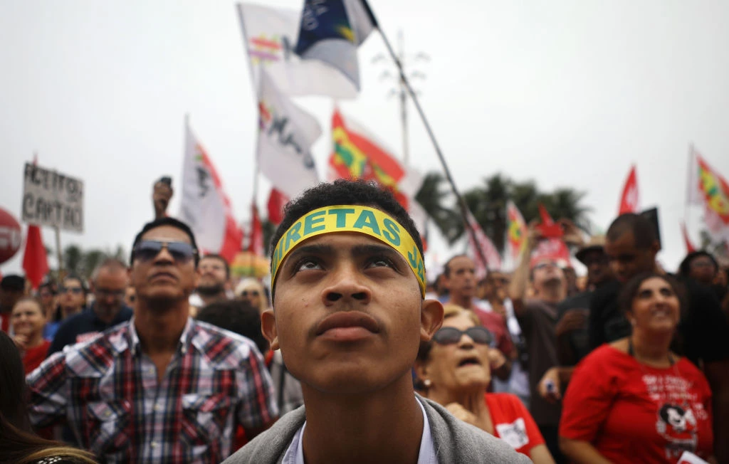 RIO DE JANEIRO, BRAZIL - MAY 28:  Protestors rally at a demonstration and concert calling for direct presidential elections on May 28, 2017 in Rio de Janeiro, Brazil. President Michel Temer is mired in allegations of endorsing bribery in a scandal which threatens to bring down his brief presidency.  (Photo by Mario Tama/Getty Images)