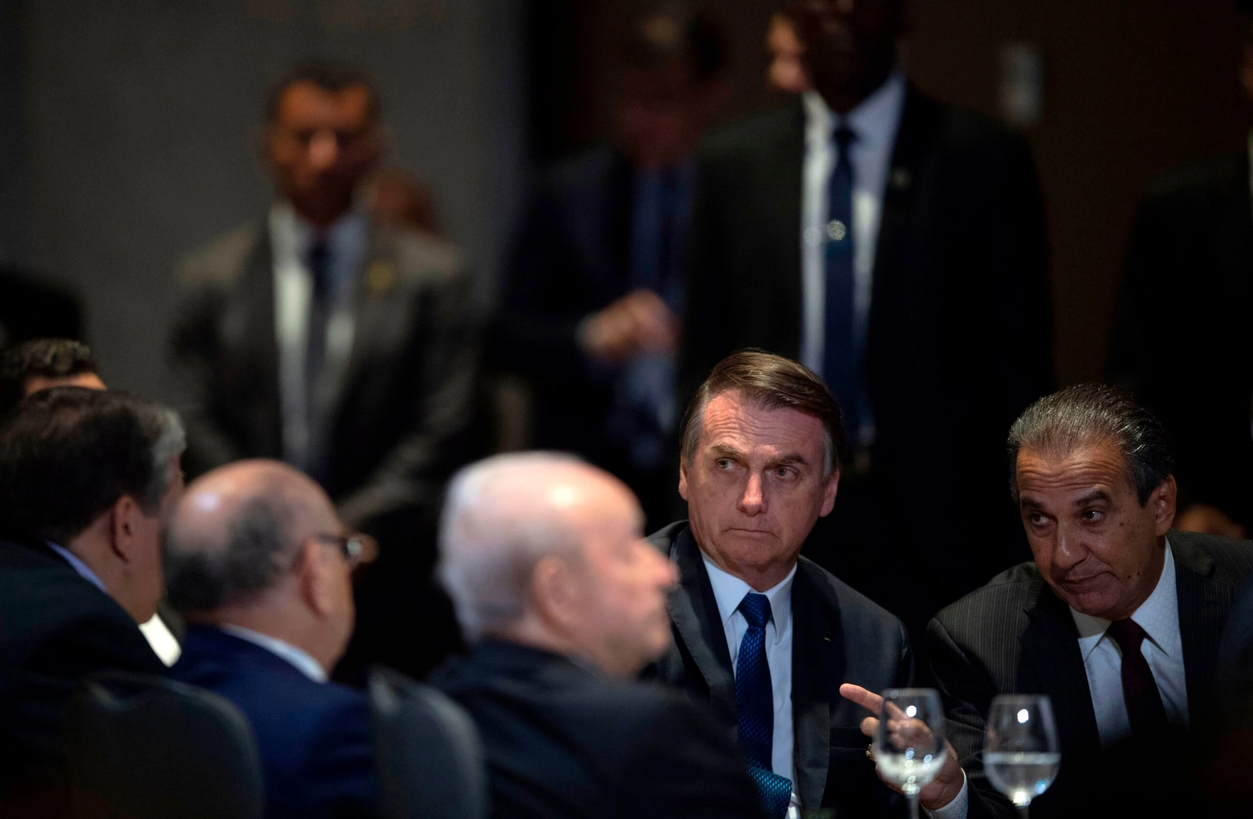 Brazilian President Jair Bolsonaro (2-R) and Brazilian Congressman and Bishop Silas Malafaia (R) attend a meeting with evangelical leaders at the Hilton Barra Hotel, in Barra da Tijuca neighborhood, Rio de Janeiro, Brazil on April 11, 2019. (Photo by Mauro Pimentel / AFP)        (Photo credit should read MAURO PIMENTEL/AFP via Getty Images)