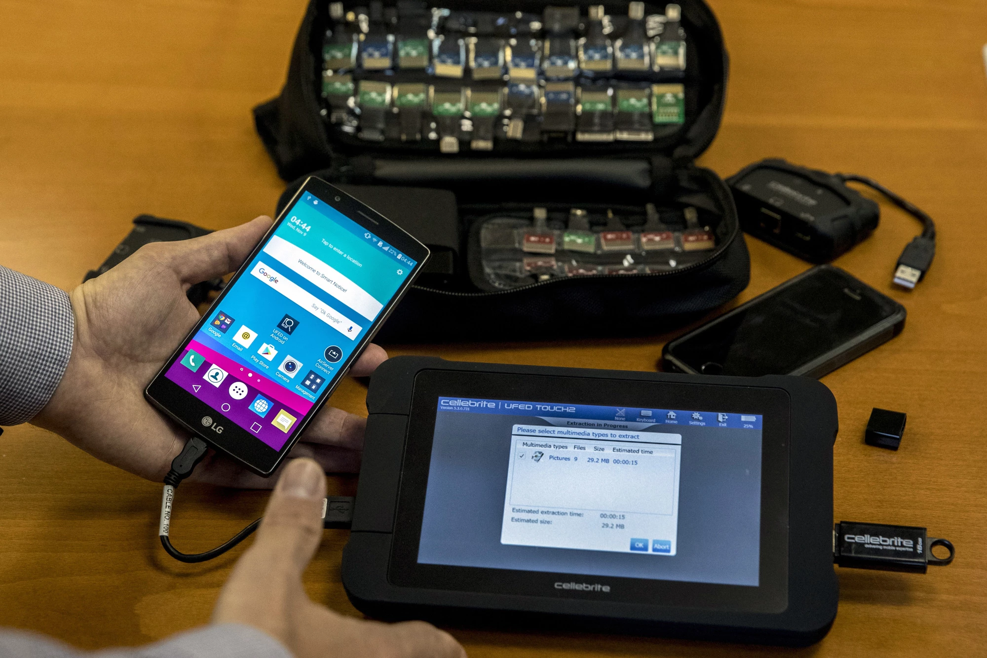 An engineer shows devices and explains the technology developed by the Israeli firm Cellebrite's technology on November 9, 2016 in the Israeli city of Petah Tikva.It only takes a few seconds for an employee of Cellebrite's technology, one of the world's leading hacking companies, to take a locked smartphone and pull the data from it. / AFP / JACK GUEZ (Photo credit should read JACK GUEZ/AFP via Getty Images)