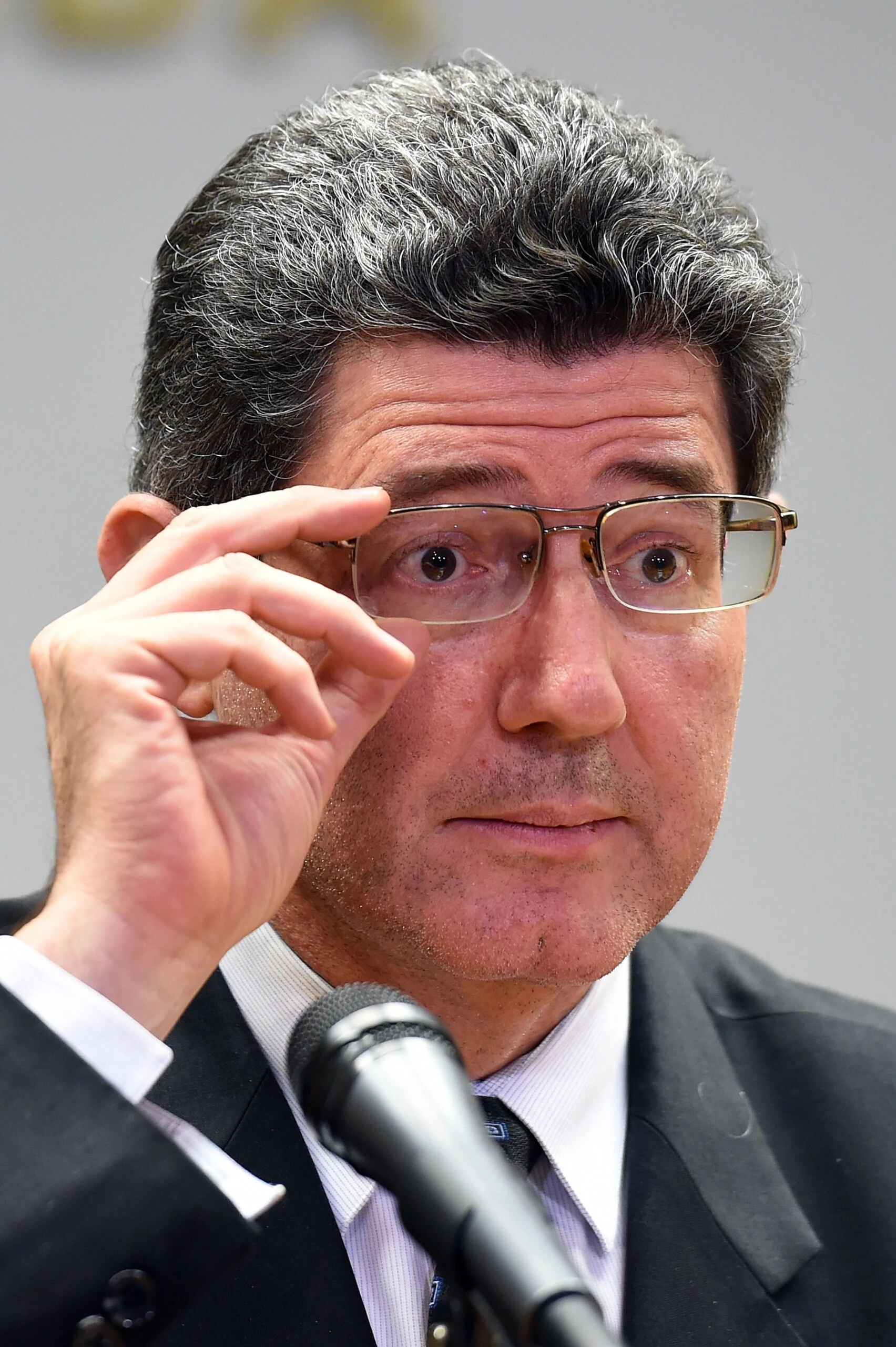 Brazilian Minister of Economy Joaquim Levy gestures during press conference at the Economy Ministry in Brasilia, on September 10, 2015. Standard & Poor's financial services company downgraded Brazil, stripping the country of its investment-grade status and leaving President Dilma Rousseff's government on life support, risking an investor rush for the exits, analysts said Thursday. AFP PHOTO/EVARISTO SA (Photo credit should read EVARISTO SA/AFP/Getty Images)