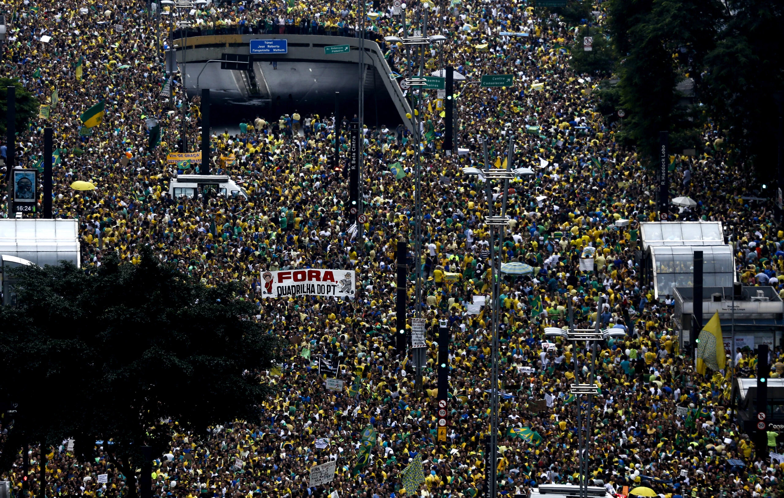 Thousands of demonstrators rally in support of the impeachment of Brazilian President Dilma Rousseff at Paulista Avenue in Sao Paulo, Brazil on March 13, 2016. Thousands of demonstrators clad in the yellow and green national flag's colors protested Sunday in several cities of Brazil to demand Rousseff's removal from office. AFP PHOTO-Miguel SCHINCARIOL / AFP / Miguel Schincariol (Photo credit should read MIGUEL SCHINCARIOL/AFP/Getty Images)