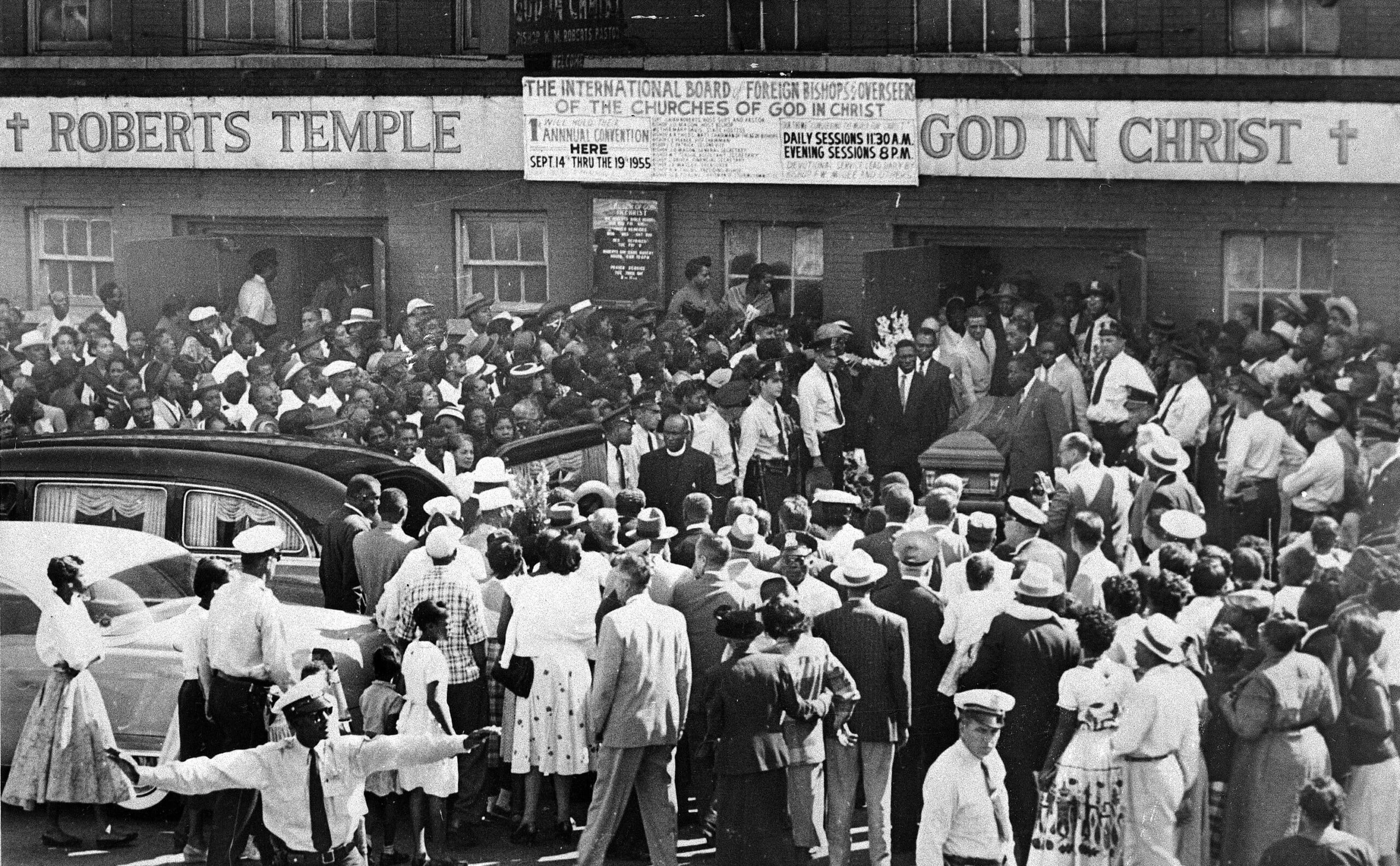 A large crowd gathers outside the Roberts Temple Church of God In Christ in Chicago, Ill., Sept. 6, 1955 as pallbearers carry the casket of Emmett Till, a 14-year-old African-American boy who was slain while on a visit to Mississippi. Police estimate a crowd of about 2,000. (AP Photo)