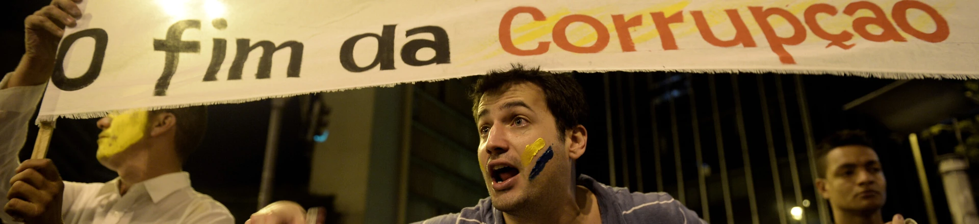 Demostrators stage a protest in front of policemen against corruption and price hikes in Belo Horizonte, Brazil on June 22, 2013. Brazil girded for more street protests Saturday despite President Dilma Rousseff's conciliatory remarks pledging to improve public services and fight corruption, while warning against further violence. Her speech came a day after more than one million people marched in cities across the country to slam the huge cost of hosting next June's World Cup, put at some 15 billion dollars, while public services such as schools and hospitals are lacking. AFP PHOTO / Yuri CORTEZ (Photo credit should read YURI CORTEZ/AFP/Getty Images) Demostrators stage a protest in front of policemen against corruption and price hikes in Belo Horizonte, Brazil on June 22, 2013. Brazil girded for more street protests Saturday despite President Dilma Rousseff's conciliatory remarks pledging to improve public services and fight corruption, while warning against further violence. Her speech came a day after more than one million people marched in cities across the country to slam the huge cost of hosting next June's World Cup, put at some 15 billion dollars, while public services such as schools and hospitals are lacking. AFP PHOTO / Yuri CORTEZ (Photo credit should read YURI CORTEZ/AFP/Getty Images)