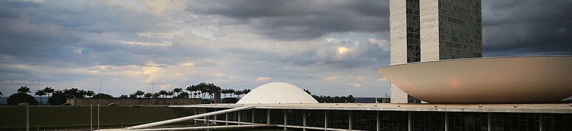 BRASILIA, BRAZIL - OCTOBER 27: People linger in front of the Brazilian National Congress building on October 27, 2014 in Brasilia, Brazil. Brazil's left-wing President Dilma Rousseff was narrowly re-elected yesterday and will serve another four years in Brazil's unique planned capital city. The modernist city was founded in 1960 and replaced Rio de Janeiro as the federal capital of Brazil. The city was designed by urban planner Lucio Costa and architect Oscar Niemeyer and is now a UNESCO World Hertiage site. (Photo by Mario Tama/Getty Images) BRASILIA, BRAZIL - OCTOBER 27: People linger in front of the Brazilian National Congress building on October 27, 2014 in Brasilia, Brazil. Brazil's left-wing President Dilma Rousseff was narrowly re-elected yesterday and will serve another four years in Brazil's unique planned capital city. The modernist city was founded in 1960 and replaced Rio de Janeiro as the federal capital of Brazil. The city was designed by urban planner Lucio Costa and architect Oscar Niemeyer and is now a UNESCO World Hertiage site. (Photo by Mario Tama/Getty Images)