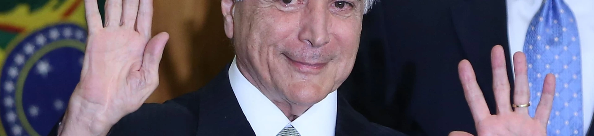 BRASILIA, BRAZIL - MAY 12: Brazil's interim President Michel Temer waves at a signing ceremony for new government ministers at the Planalto presidential palace after the Senate voted to accept impeachment charges against suspended President Dilma Rousseff on May 12, 2016 in Brasilia, Brazil. Rousseff has been suspended from her presidential duties and will face a Senate trial for alleged manipulation of government accounts. (Photo by Mario Tama/Getty Images) BRASILIA, BRAZIL - MAY 12: Brazil's interim President Michel Temer waves at a signing ceremony for new government ministers at the Planalto presidential palace after the Senate voted to accept impeachment charges against suspended President Dilma Rousseff on May 12, 2016 in Brasilia, Brazil. Rousseff has been suspended from her presidential duties and will face a Senate trial for alleged manipulation of government accounts. (Photo by Mario Tama/Getty Images)