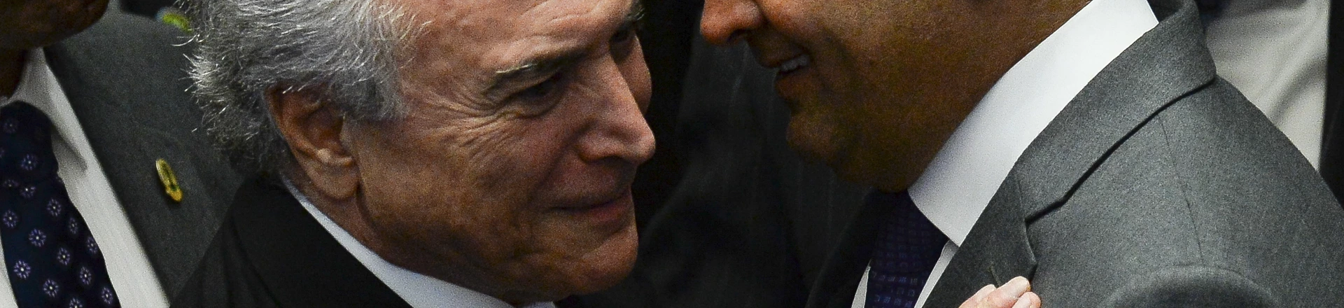 President Michel Temer (L) speaks with senator Aecio Neves before taking office before the plenary of the Brazilian Senate in Brasilia, on August 31, 2016.
Brazil's Dilma Rousseff was stripped of the country's presidency in an impeachment vote Wednesday and replaced by her bitter rival Michel Temer, shifting Latin America's biggest economy sharply to the right. / AFP PHOTO / ANDRESSA ANHOLETE (Photo credit should read ANDRESSA ANHOLETE/AFP/Getty Images) President Michel Temer (L) speaks with senator Aecio Neves before taking office before the plenary of the Brazilian Senate in Brasilia, on August 31, 2016.
Brazil's Dilma Rousseff was stripped of the country's presidency in an impeachment vote Wednesday and replaced by her bitter rival Michel Temer, shifting Latin America's biggest economy sharply to the right. / AFP PHOTO / ANDRESSA ANHOLETE (Photo credit should read ANDRESSA ANHOLETE/AFP/Getty Images)