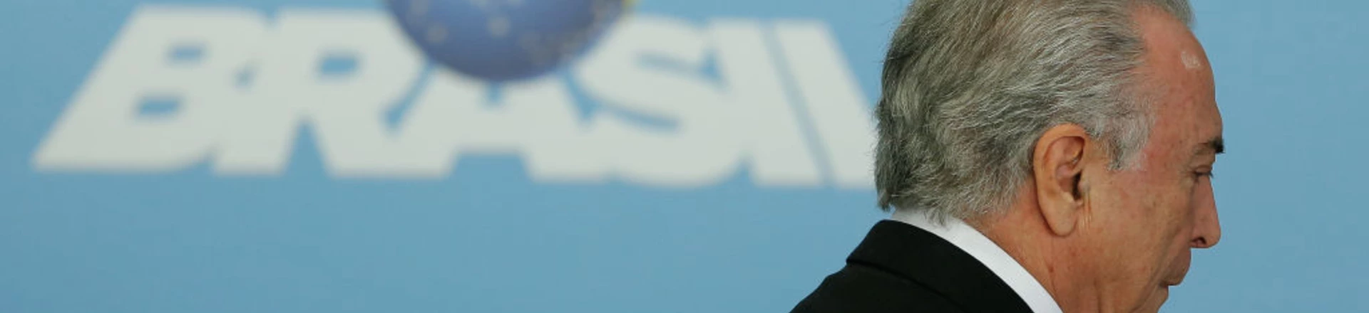 Brazil's President Michel Temer arrives for a ceremony to announce the airports' franchise programme, at the Planalto Palace in Brasilia, Brazil on July 27, 2017.
Brazilian President Michel Temer's popularity fell from 10 percent in March to a meager 5 percent, according to a poll released on Thursday in the prelude to the voting at the Chamber of Deputies to decide if a corruption report against the conservative leader advances to the supreme court. / AFP PHOTO / Sergio LIMA (Photo credit should read SERGIO LIMA/AFP/Getty Images) Brazil's President Michel Temer arrives for a ceremony to announce the airports' franchise programme, at the Planalto Palace in Brasilia, Brazil on July 27, 2017.
Brazilian President Michel Temer's popularity fell from 10 percent in March to a meager 5 percent, according to a poll released on Thursday in the prelude to the voting at the Chamber of Deputies to decide if a corruption report against the conservative leader advances to the supreme court. / AFP PHOTO / Sergio LIMA (Photo credit should read SERGIO LIMA/AFP/Getty Images)