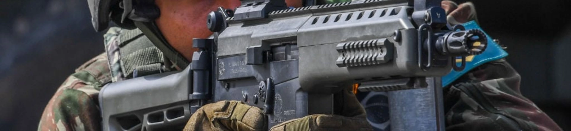 A soldier takes position at the Lins de Vasconcelos slum complex during a crackdown on crime gangs in Rio de Janeiro, Brazil, on August 5, 2017.Thousands of Brazilian army troops raided Rio de Janeiro slums leaving parts of the city looking like a war zone. Their main goal was to stop gangs behind a surge in brazen robberies of commercial trucks, with arrest warrants issued for 40 people. However, the unusually aggressive pre-dawn operation also follows wider concerns that nearly bankrupt post-Olympic Rio is spinning out of control. / AFP PHOTO / Apu Gomes (Photo credit should read APU GOMES/AFP/Getty Images) A soldier takes position at the Lins de Vasconcelos slum complex during a crackdown on crime gangs in Rio de Janeiro, Brazil, on August 5, 2017.Thousands of Brazilian army troops raided Rio de Janeiro slums leaving parts of the city looking like a war zone. Their main goal was to stop gangs behind a surge in brazen robberies of commercial trucks, with arrest warrants issued for 40 people. However, the unusually aggressive pre-dawn operation also follows wider concerns that nearly bankrupt post-Olympic Rio is spinning out of control. / AFP PHOTO / Apu Gomes (Photo credit should read APU GOMES/AFP/Getty Images)