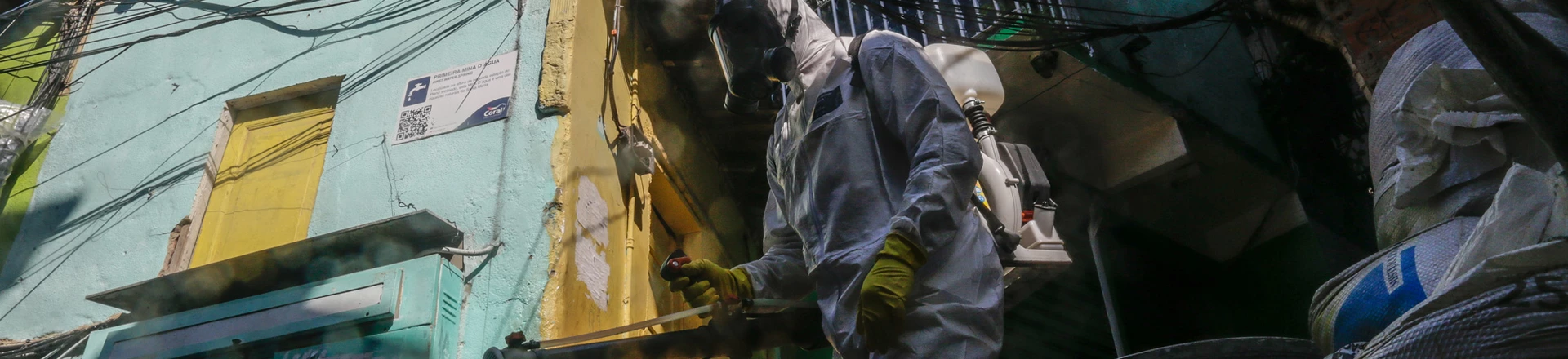 A worker wearing personal protective equipment (PPE) performs disinfection operations at Dona Marta favela in Rio de Janeiro, Brazil, on Saturday, March 27, 2021. Staggering under its worst period of the pandemic, with daily records of caseloads and deaths, Brazil is facing a daunting development: a rising number of deaths among the young. Photographer: Andre Coelho/Bloomberg via Getty Images A worker wearing personal protective equipment (PPE) performs disinfection operations at Dona Marta favela in Rio de Janeiro, Brazil, on Saturday, March 27, 2021. Staggering under its worst period of the pandemic, with daily records of caseloads and deaths, Brazil is facing a daunting development: a rising number of deaths among the young. Photographer: Andre Coelho/Bloomberg via Getty Images
