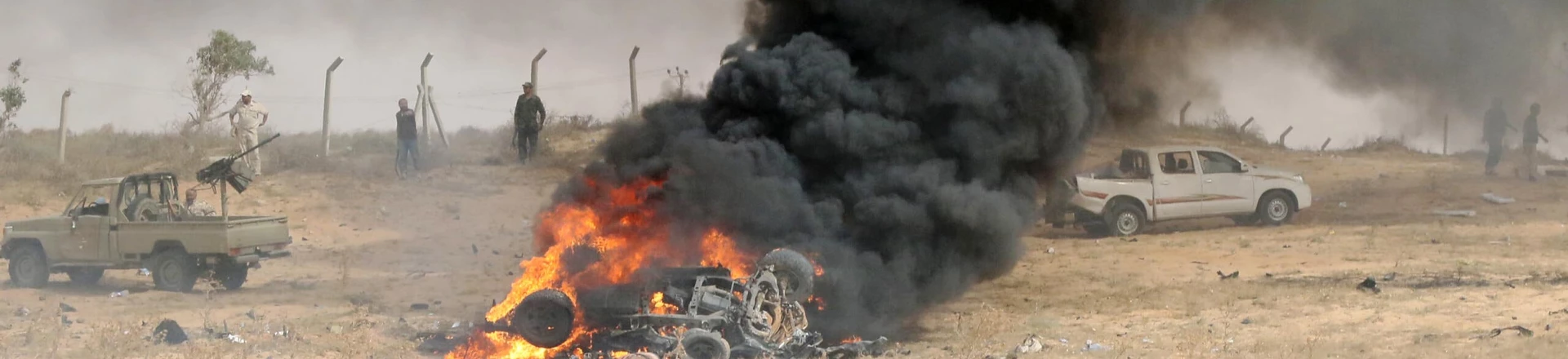 Forces loyal to Libya's UN-backed unity government gather at the site of a car-bomb attack carried out by an Islamic State (IS) group jihadist at the western entrance of Sirte on June 2, 2016.
According to Libyan officials fighting resumed on June 1 on the outskirts of Sirte between their forces and jihadist during which three pro-government troops had been killed and 10 more wounded. Sirte was the hometown of slain dictator Moamer Kadhafi and, since seizing it in June last year, IS has turned it into a recruitment and training camp / AFP / MAHMUD TURKIA (Photo credit should read MAHMUD TURKIA/AFP/Getty Images) Forces loyal to Libya's UN-backed unity government gather at the site of a car-bomb attack carried out by an Islamic State (IS) group jihadist at the western entrance of Sirte on June 2, 2016.
According to Libyan officials fighting resumed on June 1 on the outskirts of Sirte between their forces and jihadist during which three pro-government troops had been killed and 10 more wounded. Sirte was the hometown of slain dictator Moamer Kadhafi and, since seizing it in June last year, IS has turned it into a recruitment and training camp / AFP / MAHMUD TURKIA (Photo credit should read MAHMUD TURKIA/AFP/Getty Images)