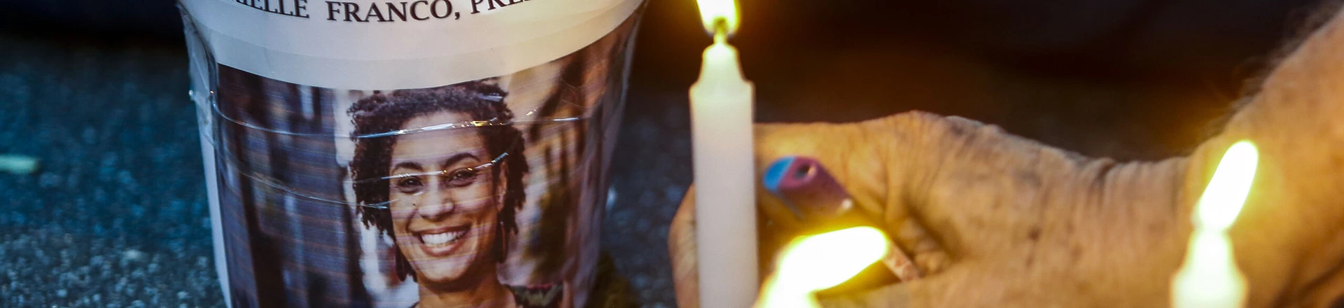 An elderly man lights a candle during a rally against the murder of Brazilian councilwoman and activist Marielle Franco, in Sao Paulo Brazil on March 15, 2018.Brazilians mourned for the Rio de Janeiro councilwoman and outspoken critic of police brutality who was shot in the city center in an assassination-style killing on the eve. / AFP PHOTO / Miguel SCHINCARIOL (Photo credit should read MIGUEL SCHINCARIOL/AFP/Getty Images) An elderly man lights a candle during a rally against the murder of Brazilian councilwoman and activist Marielle Franco, in Sao Paulo Brazil on March 15, 2018.Brazilians mourned for the Rio de Janeiro councilwoman and outspoken critic of police brutality who was shot in the city center in an assassination-style killing on the eve. / AFP PHOTO / Miguel SCHINCARIOL (Photo credit should read MIGUEL SCHINCARIOL/AFP/Getty Images)