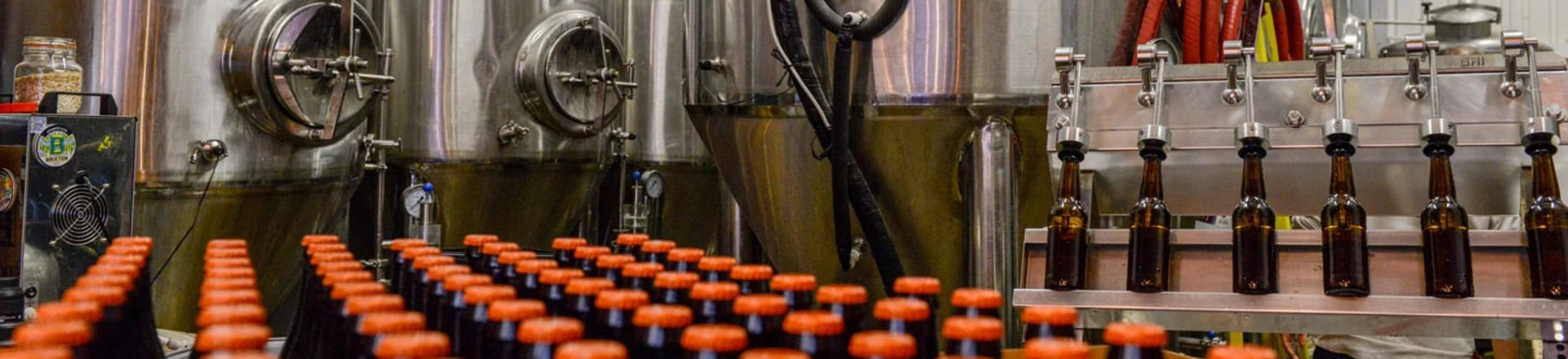LONDON, ENGLAND - DECEMBER 08: A batch of bottled Megawatt Double I.P.A. lies in front of the fermenting vessels at inner city craft beer makers Brixton Brewery on December 8, 2015 in London, England. Located in three railway arches on Brixton Station Road, the Brixton Brewery was founded in 2013 by two local couples and hand craft nine varieties of beer in small batches. The brewery has expanded into a third railway arch at the end of 2015 as the business grows. (Photo by Chris Ratcliffe/Getty Images) LONDON, ENGLAND - DECEMBER 08: A batch of bottled Megawatt Double I.P.A. lies in front of the fermenting vessels at inner city craft beer makers Brixton Brewery on December 8, 2015 in London, England. Located in three railway arches on Brixton Station Road, the Brixton Brewery was founded in 2013 by two local couples and hand craft nine varieties of beer in small batches. The brewery has expanded into a third railway arch at the end of 2015 as the business grows. (Photo by Chris Ratcliffe/Getty Images)