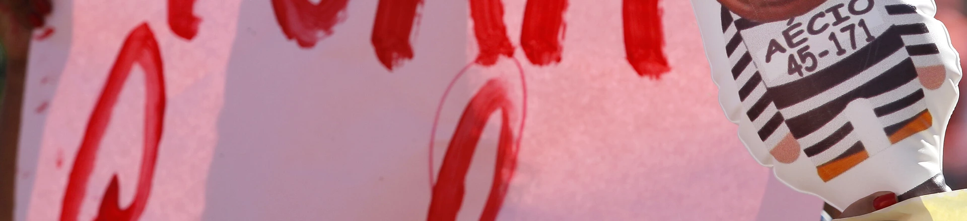 A supporter of Brazilian President Dilma Rousseff holds a balloon depicting the president of the Brazilian Social Democracy Party (PSDB) Aecio Neves and a sign reading "Cunha out" - referring to the president of the lower house of the Brazilian Congress Eduardo Cunha- during a demo in front of the National Congress in Brasilia, on April 17, 2016. Rousseff risks being driven from office if the lower house votes in favor of an impeachment trial Sunday. / AFP / BETO BARATA (Photo credit should read BETO BARATA/AFP/Getty Images) A supporter of Brazilian President Dilma Rousseff holds a balloon depicting the president of the Brazilian Social Democracy Party (PSDB) Aecio Neves and a sign reading "Cunha out" - referring to the president of the lower house of the Brazilian Congress Eduardo Cunha- during a demo in front of the National Congress in Brasilia, on April 17, 2016. Rousseff risks being driven from office if the lower house votes in favor of an impeachment trial Sunday. / AFP / BETO BARATA (Photo credit should read BETO BARATA/AFP/Getty Images)