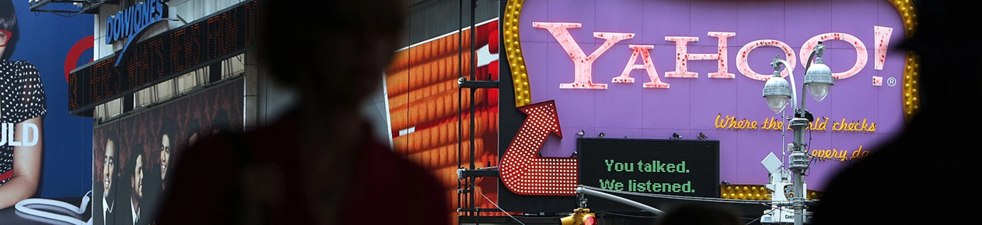 NEW YORK - JULY 29: Pedestrians walk by a Yahoo sign in Times Square on July 29, 2009 in New York City. Taking aim at Google?s dominance, technology companies Microsoft and Yahoo announced Wednesday that they have reached a 10 year internet search partnership. (Photo by Spencer Platt/Getty Images) NEW YORK - JULY 29: Pedestrians walk by a Yahoo sign in Times Square on July 29, 2009 in New York City. Taking aim at Google?s dominance, technology companies Microsoft and Yahoo announced Wednesday that they have reached a 10 year internet search partnership. (Photo by Spencer Platt/Getty Images)